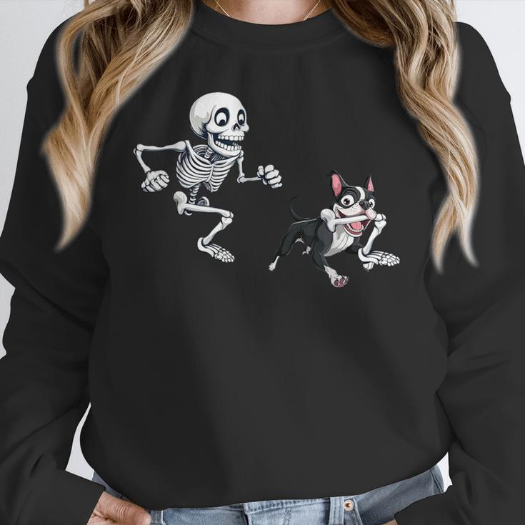 Skeleton Chasing Dog Boston Terrier Halloween Pet Lover Women Crewneck Sweatshirt, Boston Terrier Halloween Gifts, funny design