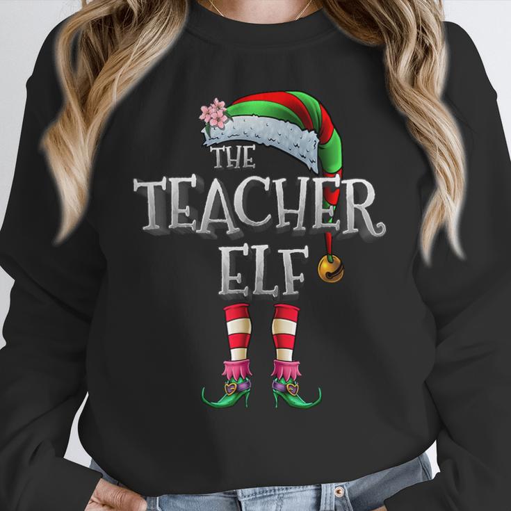 The Teacher Elf Shirt Matching Family Christmas Elf Men Women Kids Women Crewneck Sweatshirt, funny design The Teacher Elf Shirt Matching Family Christmas Elf Men Women Kids Women Crewneck Sweatshirt, funny design
