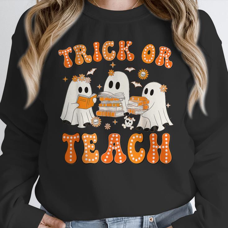 Teacher Halloween Trick Or Teach Retro Groovy Floral Ghost Women Crewneck Sweatshirt, Groovy Teacher Gifts, funny design Teacher Halloween Trick Or Teach Retro Groovy Floral Ghost Women Crewneck Sweatshirt, Groovy Teacher Gifts, funny design