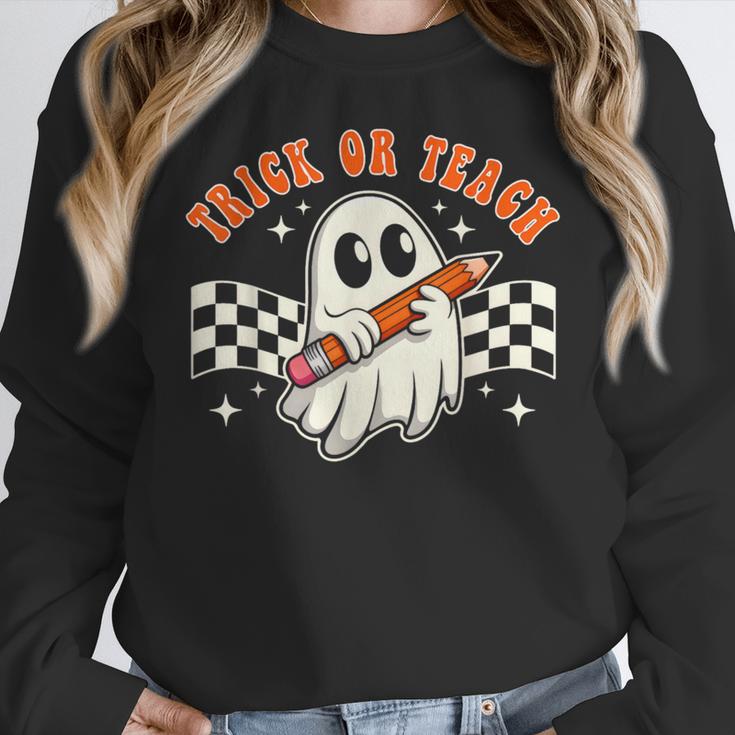 Trick Or Teach Groovy Retro Ghost Halloween Teacher Kids Women Crewneck Sweatshirt, Groovy Teacher Gifts, funny design Trick Or Teach Groovy Retro Ghost Halloween Teacher Kids Women Crewneck Sweatshirt, Groovy Teacher Gifts, funny design