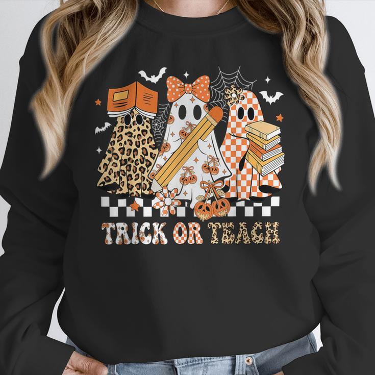 Trick Or Teach Groovy Teacher Halloween Floral Ghost Women Crewneck Sweatshirt, Groovy Teacher Gifts, funny design Trick Or Teach Groovy Teacher Halloween Floral Ghost Women Crewneck Sweatshirt, Groovy Teacher Gifts, funny design