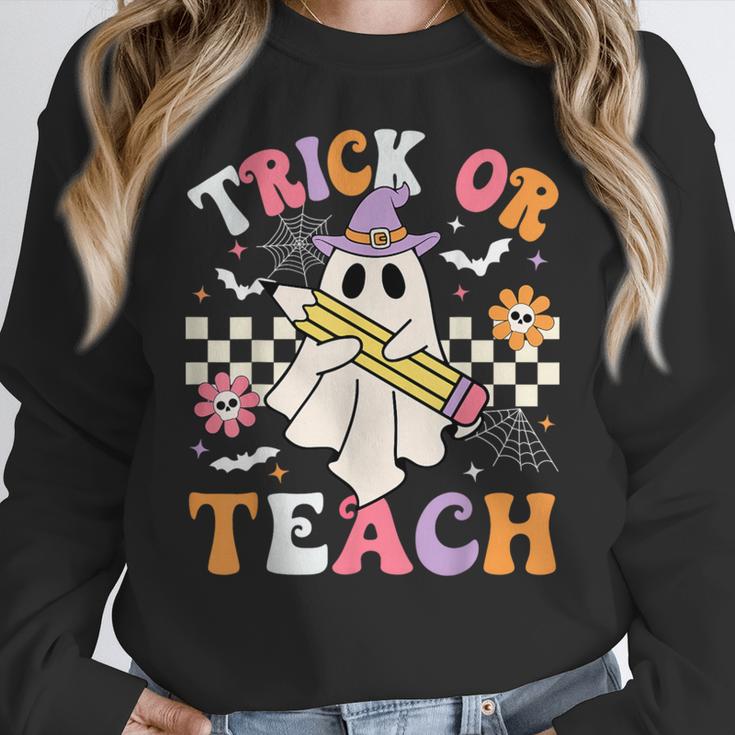 Trick Or Teach Groovy Teacher Halloween Retro Teacher Ghost Women Crewneck Sweatshirt, Groovy Teacher Gifts, funny design Trick Or Teach Groovy Teacher Halloween Retro Teacher Ghost Women Crewneck Sweatshirt, Groovy Teacher Gifts, funny design
