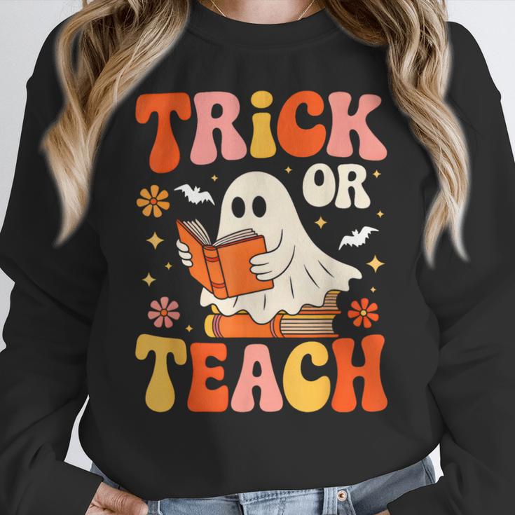 Trick Or Teach Halloween Shirt For Teacher Kids Floral Ghost Women Crewneck Sweatshirt, funny design Trick Or Teach Halloween Shirt For Teacher Kids Floral Ghost Women Crewneck Sweatshirt, funny design