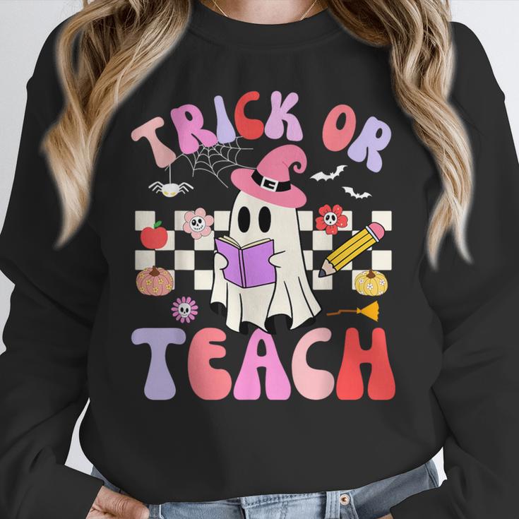 Trick Or Teach Halloween Teacher Floral Ghost Groovy Women Crewneck Sweatshirt, Groovy Teacher Gifts, funny design Trick Or Teach Halloween Teacher Floral Ghost Groovy Women Crewneck Sweatshirt, Groovy Teacher Gifts, funny design