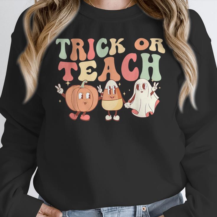 Trick Or Teach Pumpkin Candy Corn Ghost Halloween Teacher Women Crewneck Sweatshirt, funny design Trick Or Teach Pumpkin Candy Corn Ghost Halloween Teacher Women Crewneck Sweatshirt, funny design