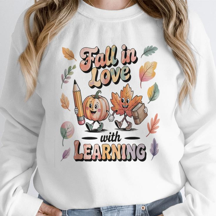 Fall In Love With Learning Teacher Autumn School Women Crewneck Sweatshirt, funny design Fall In Love With Learning Teacher Autumn School Women Crewneck Sweatshirt, funny design