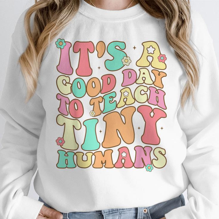 It's A Good Day To Teach Tiny Humans Teacher Teaching Women Crewneck Sweatshirt, funny design It's A Good Day To Teach Tiny Humans Teacher Teaching Women Crewneck Sweatshirt, funny design