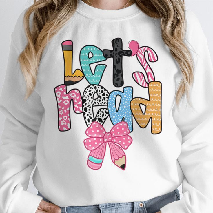 Lets Read Reading Teacher Back To School Literacy Pencil Bow Women Crewneck Sweatshirt, funny design