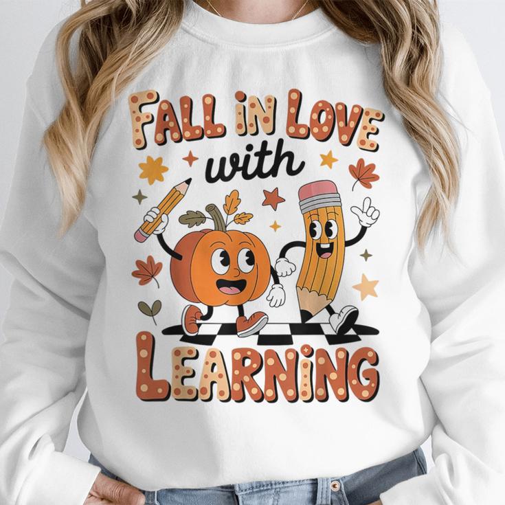 Retro Fall In Love With Learning Autumn Pumpkin Teacher Kids Women Crewneck Sweatshirt, funny design Retro Fall In Love With Learning Autumn Pumpkin Teacher Kids Women Crewneck Sweatshirt, funny design