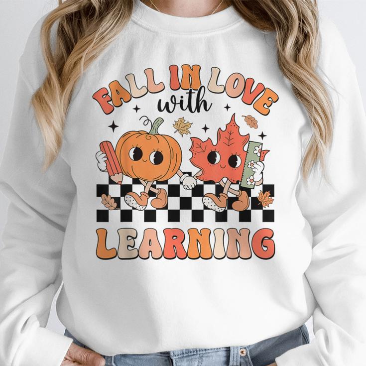Retro Fall In Love With Learning Autumn Pumpkin Teacher Women Crewneck Sweatshirt, funny design Retro Fall In Love With Learning Autumn Pumpkin Teacher Women Crewneck Sweatshirt, funny design