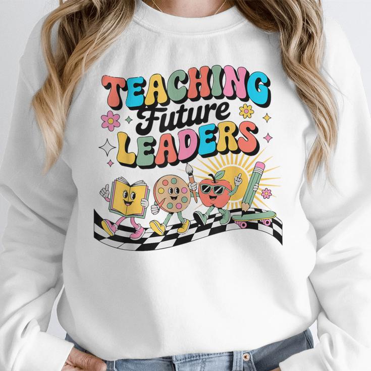 Retro Teaching Future Leaders Groovy Teacher Back To School Women Crewneck Sweatshirt, Future Teacher Gifts, Groovy Teacher Gifts, funny design