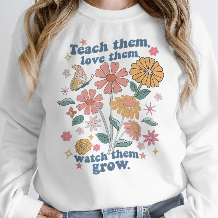 Teach Them Love Them Watch Them Grow Retro Teacher Floral Women Crewneck Sweatshirt, funny design