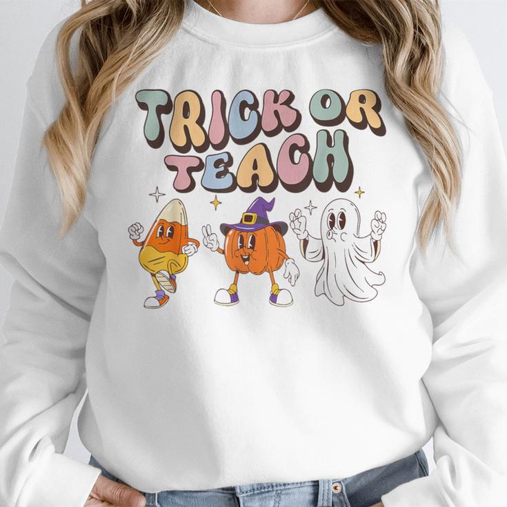 Trick Or Teach Candy Corn Pumpkin Ghost Teacher Women Crewneck Sweatshirt, funny design