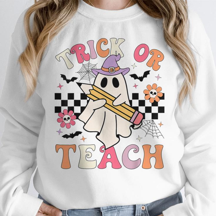 Trick Or Teach Groovy Teacher Halloween Retro Floral Ghost Women Crewneck Sweatshirt, Groovy Teacher Gifts, funny design