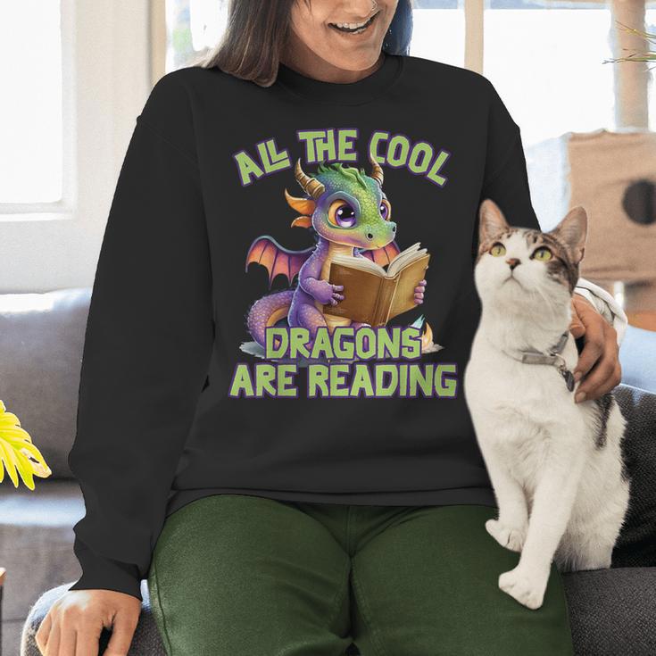 All The Cool Dragons Are Reading Dragon Teacher Women Crewneck Sweatshirt, gift for family, gift for coworker All The Cool Dragons Are Reading Dragon Teacher Women Crewneck Sweatshirt, gift for family, gift for coworker