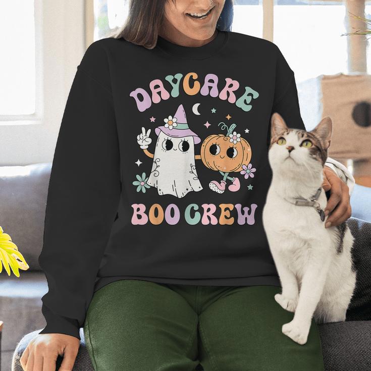 Daycare Boo Crew Groovy Halloween Floral Ghost Kid Teacher Women Crewneck Sweatshirt, Groovy Teacher Sweatshirts, gift for family, gift for coworker