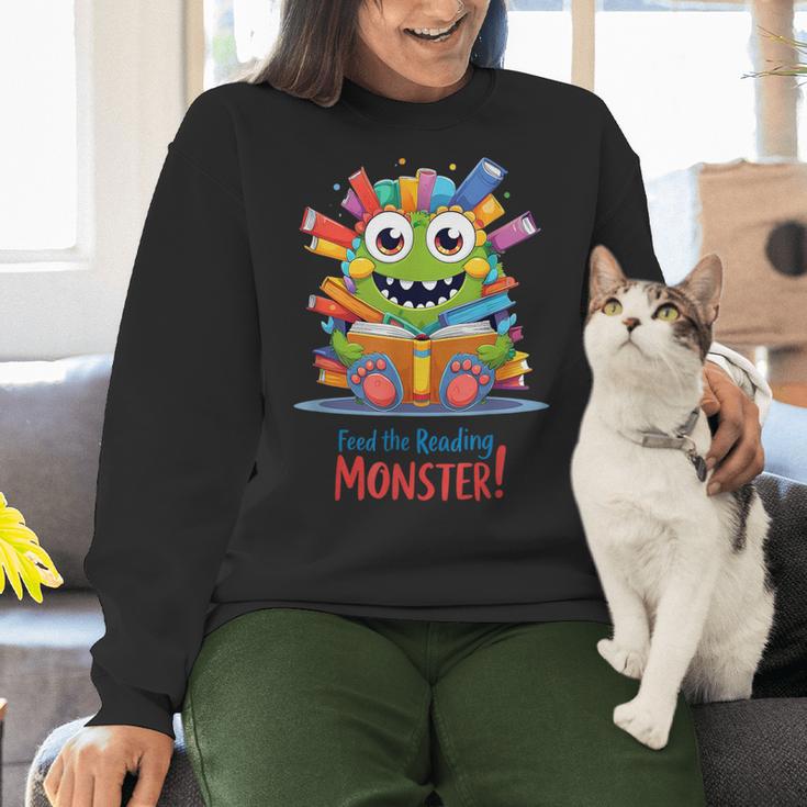 Feed The Reading Monster Halloween Teacher Women Crewneck Sweatshirt, gift for family, gift for coworker