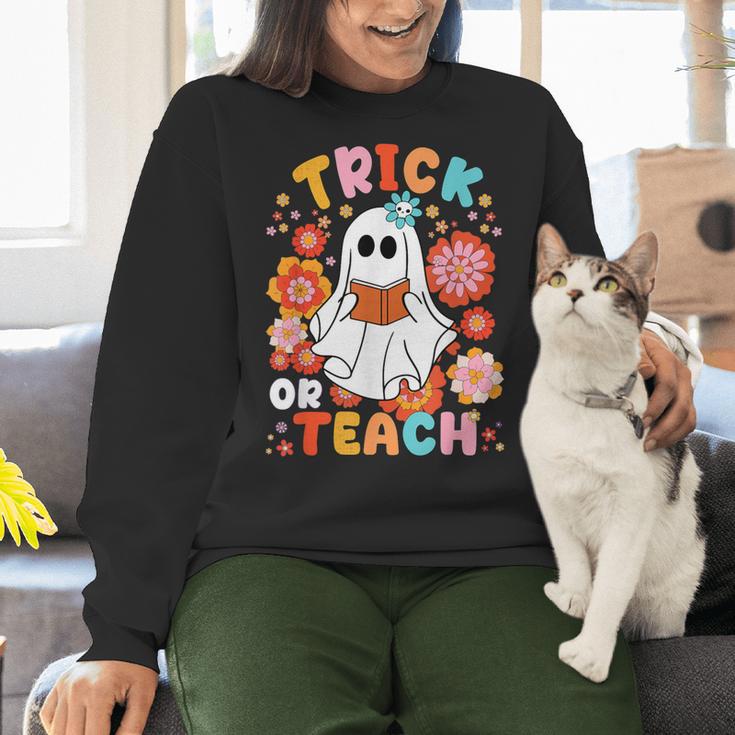 Groovy Halloween Trick Or Teach Retro Floral Ghost Teacher For Men Women Kids Women Crewneck Sweatshirt, Groovy Teacher Sweatshirts, gift for family, gift for coworker Groovy Halloween Trick Or Teach Retro Floral Ghost Teacher For Men Women Kids Women Crewneck Sweatshirt, Groovy Teacher Sweatshirts, gift for family, gift for coworker