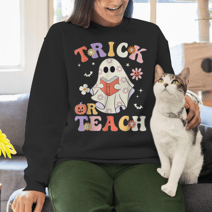 Groovy Halloween Trick Or Teach Retro Floral Ghost Teacher Women Crewneck Sweatshirt, Groovy Teacher Sweatshirts, gift for family, gift for coworker Groovy Halloween Trick Or Teach Retro Floral Ghost Teacher Women Crewneck Sweatshirt, Groovy Teacher Sweatshirts, gift for family, gift for coworker