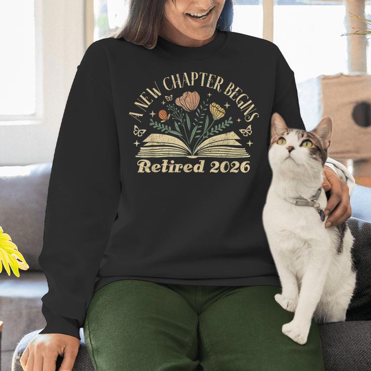 A New Chapter Begins Retired 2026 Teacher Retirement Women Crewneck Sweatshirt, gift for family, gift for coworker