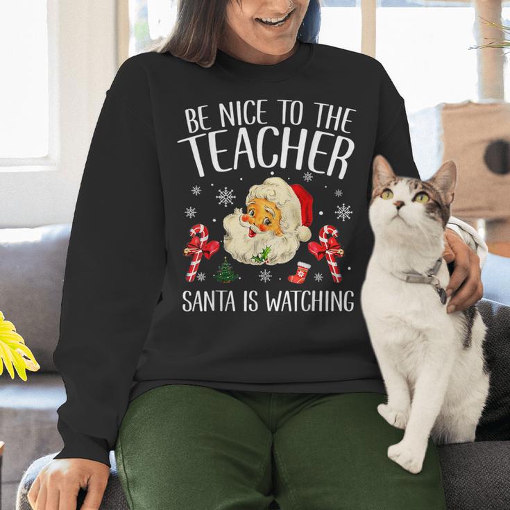 Be Nice To The Teacher Santa Is Watching School Christmas Women Crewneck Sweatshirt, gift for family, gift for coworker Be Nice To The Teacher Santa Is Watching School Christmas Women Crewneck Sweatshirt, gift for family, gift for coworker