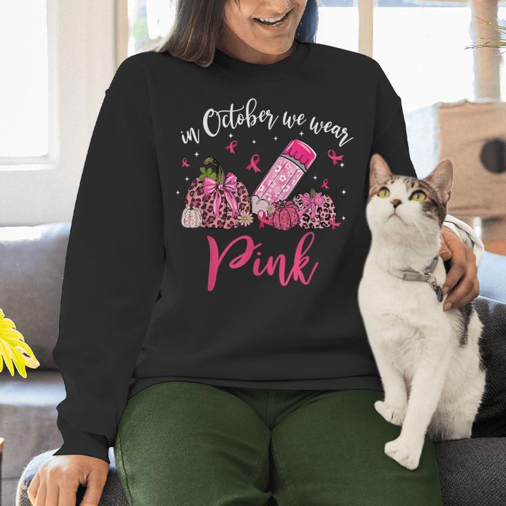 In October We Wear Pink Apple Teacher Daisy Breast Cancer Women Crewneck Sweatshirt, gift for family, gift for coworker In October We Wear Pink Apple Teacher Daisy Breast Cancer Women Crewneck Sweatshirt, gift for family, gift for coworker