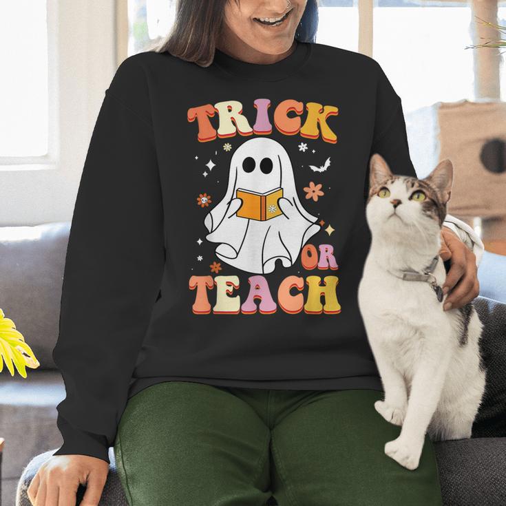 Retro Vintage Groovy Trick Or Teach Teacher Halloween For Men Women Kids Women Crewneck Sweatshirt, Groovy Teacher Sweatshirts, gift for family, gift for coworker