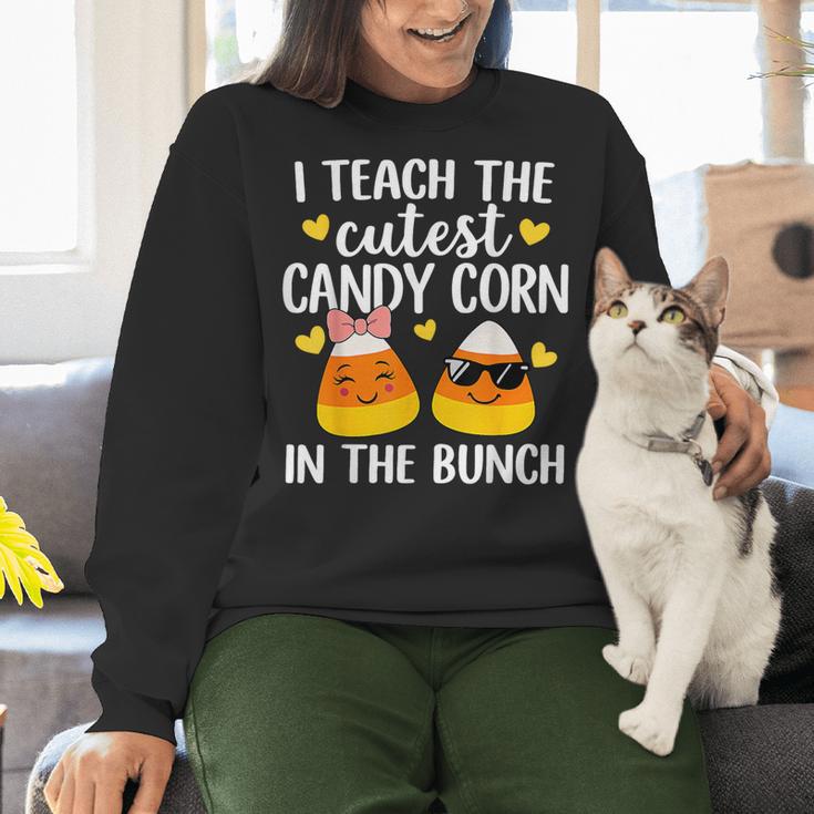 I Teach The Cutest Candy Corn In The Bunch Teacher Halloween Women Crewneck Sweatshirt, gift for family, gift for coworker I Teach The Cutest Candy Corn In The Bunch Teacher Halloween Women Crewneck Sweatshirt, gift for family, gift for coworker