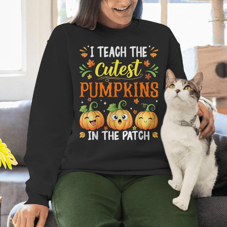 I Teach The Cutest Pumpkins Halloween Teacher Women Crewneck Sweatshirt, gift for family, gift for coworker I Teach The Cutest Pumpkins Halloween Teacher Women Crewneck Sweatshirt, gift for family, gift for coworker