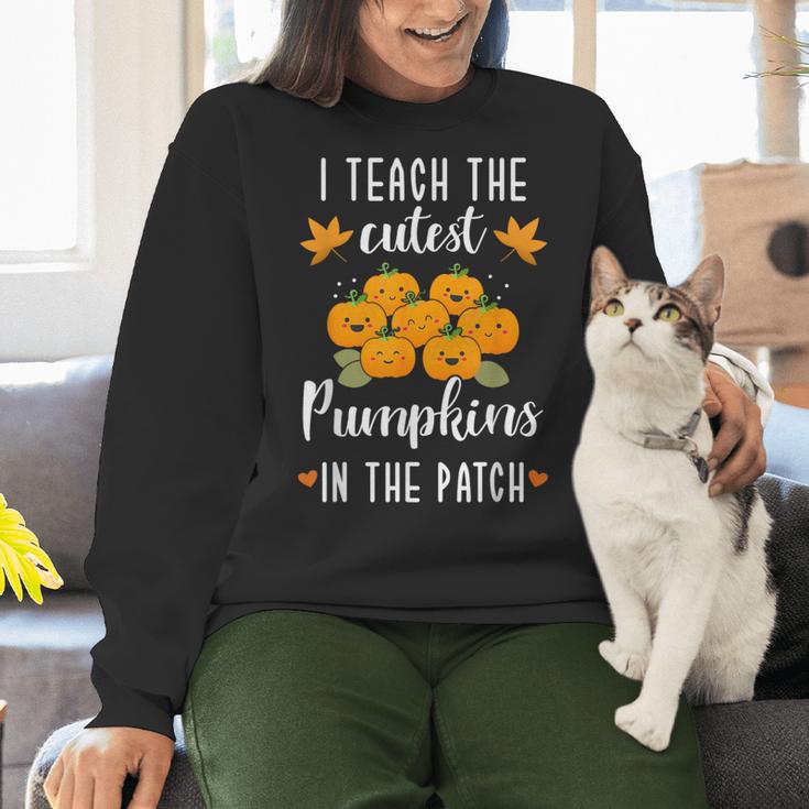 I Teach The Cutest Pumpkins In The Patch Halloween Teacher Women Crewneck Sweatshirt, gift for family, gift for coworker I Teach The Cutest Pumpkins In The Patch Halloween Teacher Women Crewneck Sweatshirt, gift for family, gift for coworker