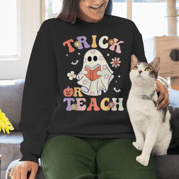 Teacher Halloween Trick Or Teach Floral Ghost Women Crewneck Sweatshirt, gift for family, gift for coworker Teacher Halloween Trick Or Teach Floral Ghost Women Crewneck Sweatshirt, gift for family, gift for coworker