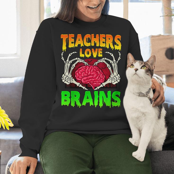 Teacher Teachers Love Brains Skeleton Hand Heart Halloween Women Crewneck Sweatshirt, gift for family, gift for coworker Teacher Teachers Love Brains Skeleton Hand Heart Halloween Women Crewneck Sweatshirt, gift for family, gift for coworker