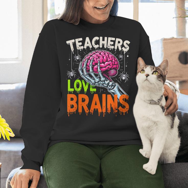 Teachers Love Brains Halloween 2025 Skeleton Costume Women Crewneck Sweatshirt, gift for family, gift for coworker Teachers Love Brains Halloween 2025 Skeleton Costume Women Crewneck Sweatshirt, gift for family, gift for coworker