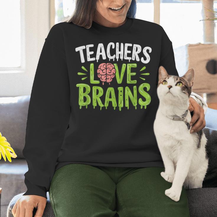 Teachers Love Brains Halloween Teacher Zombie Women Crewneck Sweatshirt, gift for family, gift for coworker Teachers Love Brains Halloween Teacher Zombie Women Crewneck Sweatshirt, gift for family, gift for coworker