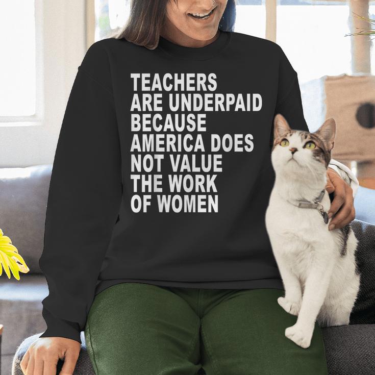 Teachers Are Underpaid Because America Does Not Value Men Women Women Crewneck Sweatshirt, gift for family, gift for coworker Teachers Are Underpaid Because America Does Not Value Men Women Women Crewneck Sweatshirt, gift for family, gift for coworker