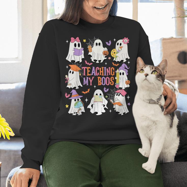 Teaching My Boos Teacher Cute Ghost Groovy Teacher Halloween Women Crewneck Sweatshirt, Groovy Teacher Sweatshirts, gift for family, gift for coworker Teaching My Boos Teacher Cute Ghost Groovy Teacher Halloween Women Crewneck Sweatshirt, Groovy Teacher Sweatshirts, gift for family, gift for coworker