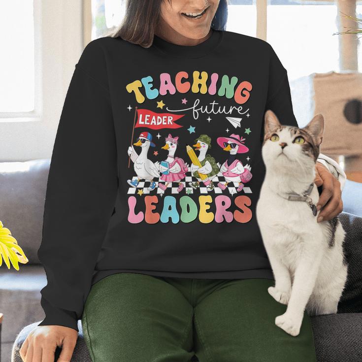 Teaching Future Leaders Groovy Teacher Back To School Women Crewneck Sweatshirt, Future Teacher Sweatshirts, Groovy Teacher Sweatshirts, gift for family, gift for coworker Teaching Future Leaders Groovy Teacher Back To School Women Crewneck Sweatshirt, Future Teacher Sweatshirts, Groovy Teacher Sweatshirts, gift for family, gift for coworker