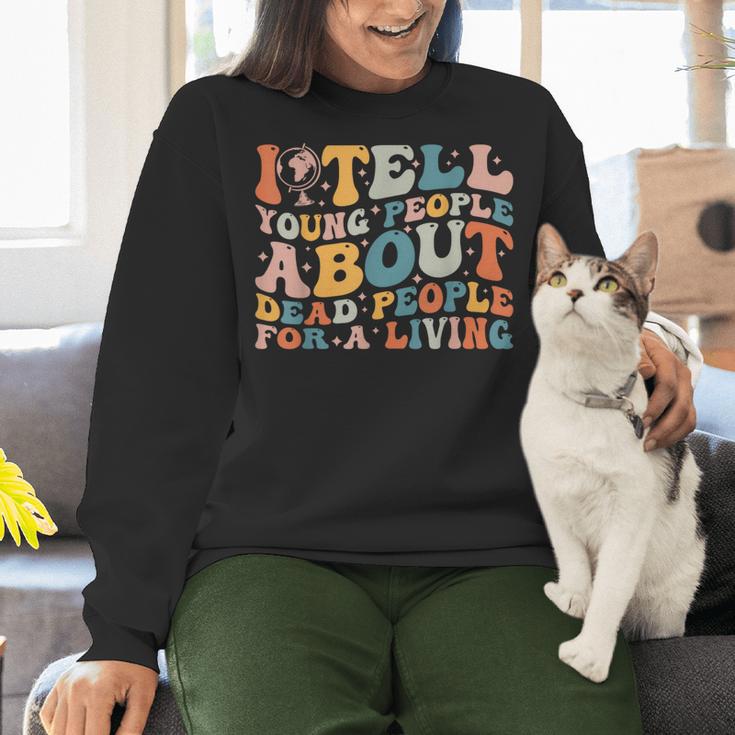 I Tell Young People About Dead People Groovy History Teacher Women Crewneck Sweatshirt, History Teacher Sweatshirts, Groovy Teacher Sweatshirts, gift for family, gift for coworker I Tell Young People About Dead People Groovy History Teacher Women Crewneck Sweatshirt, History Teacher Sweatshirts, Groovy Teacher Sweatshirts, gift for family, gift for coworker