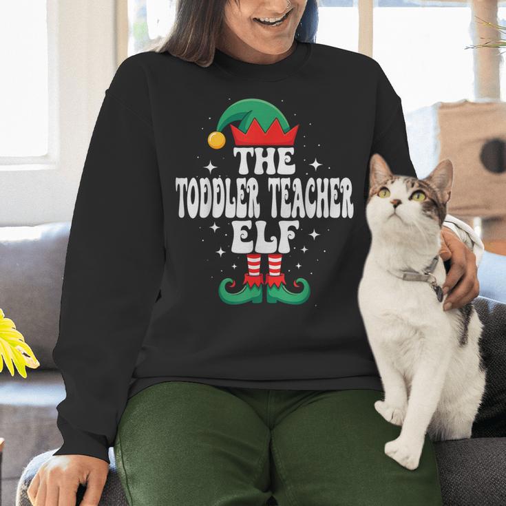 The Toddler Teacher Elf Christmas Matching Family Women Crewneck Sweatshirt, gift for family, gift for coworker The Toddler Teacher Elf Christmas Matching Family Women Crewneck Sweatshirt, gift for family, gift for coworker