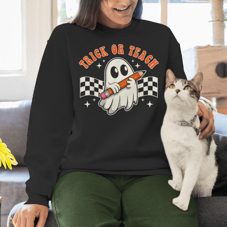 Trick Or Teach Groovy Retro Ghost Halloween Teacher Kids Women Crewneck Sweatshirt, Groovy Teacher Sweatshirts, gift for family, gift for coworker Trick Or Teach Groovy Retro Ghost Halloween Teacher Kids Women Crewneck Sweatshirt, Groovy Teacher Sweatshirts, gift for family, gift for coworker