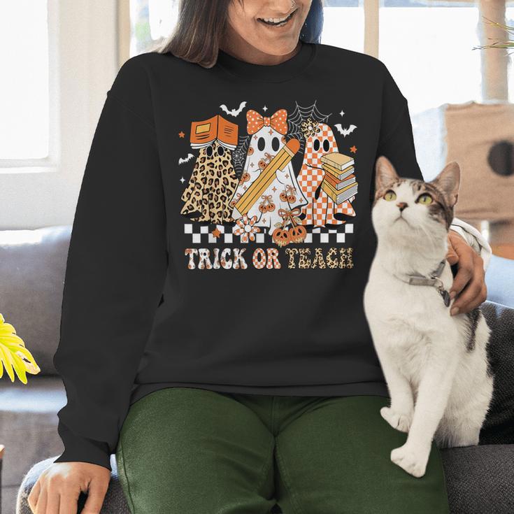 Trick Or Teach Groovy Teacher Halloween Floral Ghost Women Crewneck Sweatshirt, Groovy Teacher Sweatshirts, gift for family, gift for coworker Trick Or Teach Groovy Teacher Halloween Floral Ghost Women Crewneck Sweatshirt, Groovy Teacher Sweatshirts, gift for family, gift for coworker