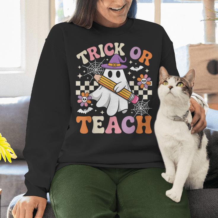Trick Or Teach Groovy Teacher Halloween Retro Ghost Women Crewneck Sweatshirt, Groovy Teacher Sweatshirts, gift for family, gift for coworker
