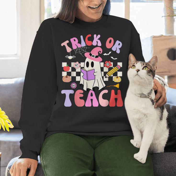 Trick Or Teach Halloween Teacher Floral Ghost Groovy Women Crewneck Sweatshirt, Groovy Teacher Sweatshirts, gift for family, gift for coworker Trick Or Teach Halloween Teacher Floral Ghost Groovy Women Crewneck Sweatshirt, Groovy Teacher Sweatshirts, gift for family, gift for coworker