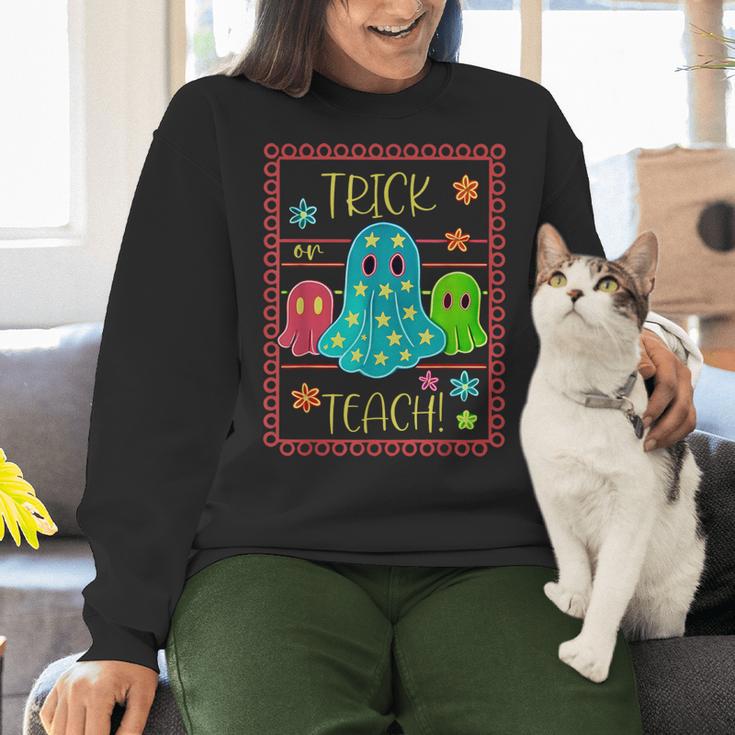 Trick Or Teach Neon Ghost Flower Teacher Spooky Halloween Women Crewneck Sweatshirt, gift for family, gift for coworker Trick Or Teach Neon Ghost Flower Teacher Spooky Halloween Women Crewneck Sweatshirt, gift for family, gift for coworker