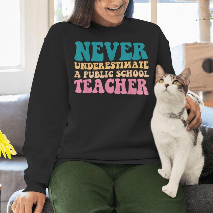 Never Underestimate A Public School Teacher Groovy Women Women Crewneck Sweatshirt, Groovy Teacher Sweatshirts, gift for family, gift for coworker Never Underestimate A Public School Teacher Groovy Women Women Crewneck Sweatshirt, Groovy Teacher Sweatshirts, gift for family, gift for coworker