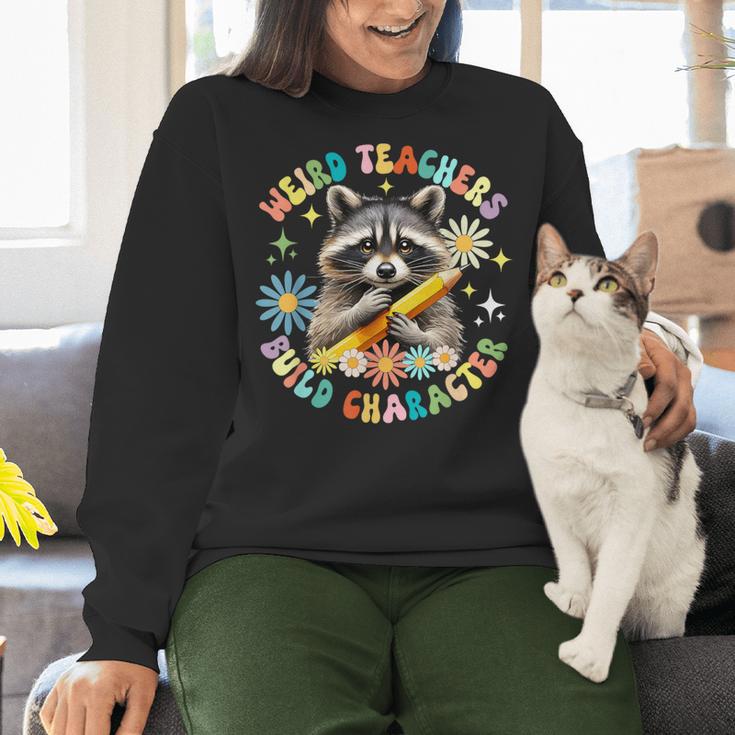 Weird Teachers Build Character Raccoon Colourful Floral Women Crewneck Sweatshirt, gift for family, gift for coworker Weird Teachers Build Character Raccoon Colourful Floral Women Crewneck Sweatshirt, gift for family, gift for coworker