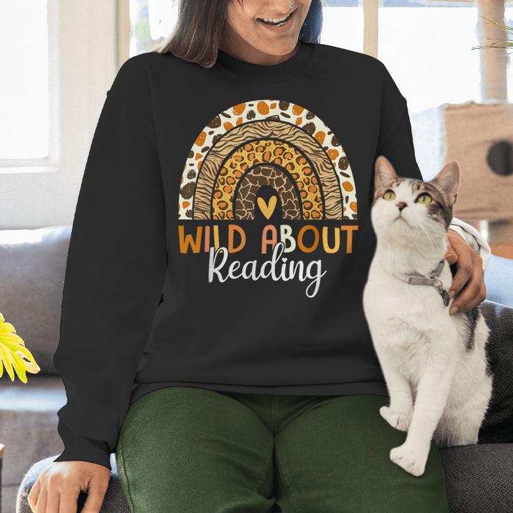 Wild About Reading Teacher Back To School Leopard Rainbow Women Crewneck Sweatshirt, gift for family, gift for coworker Wild About Reading Teacher Back To School Leopard Rainbow Women Crewneck Sweatshirt, gift for family, gift for coworker