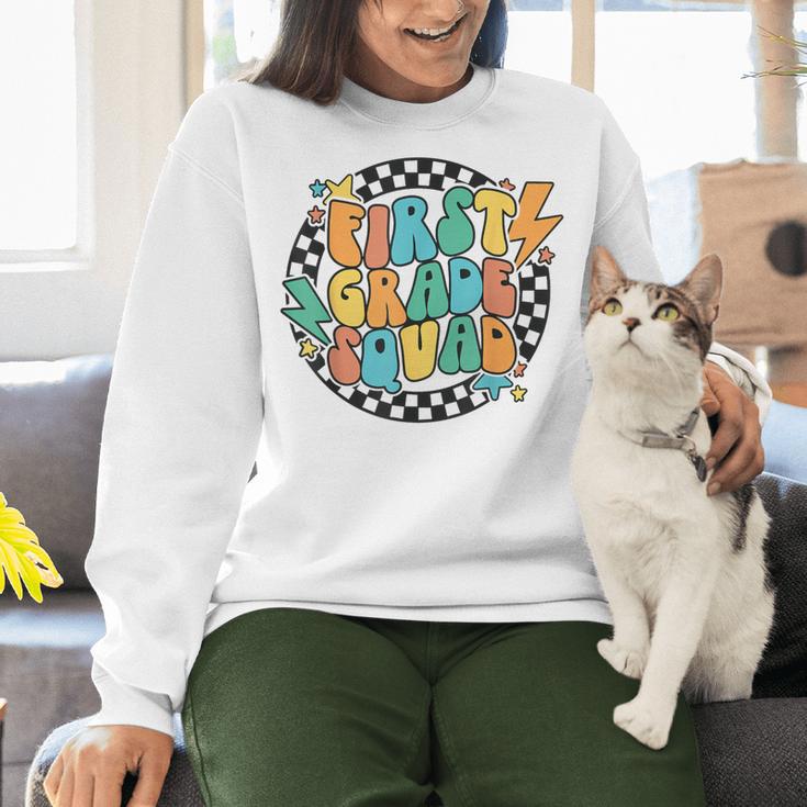 Back To School Groovy Teacher 1st First Grade Crew Squad Women Crewneck Sweatshirt, Groovy Teacher Sweatshirts, First Grade Teacher Sweatshirts, gift for family, gift for coworker