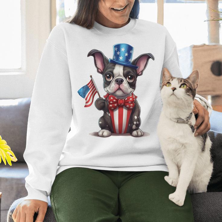 Boston Terrier Puppy Dog Holds His American Flag 4th Of July Women Crewneck Sweatshirt, American Boston Terrier Sweatshirts, Boston Terrier 4th Of July Sweatshirts, gift for family, gift for coworker