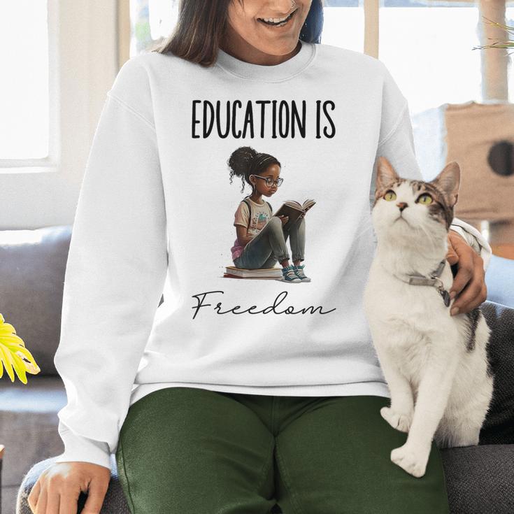 Education Is Freedom Teacher Books Black History Month Women Crewneck Sweatshirt, History Teacher Sweatshirts, gift for family, gift for coworker